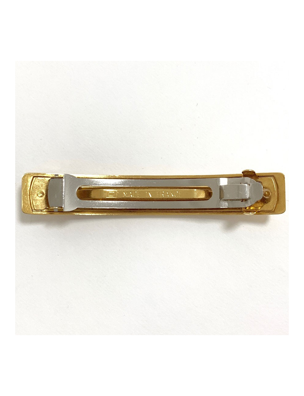 Barrette CHANEL dorée gravée C H A N E L