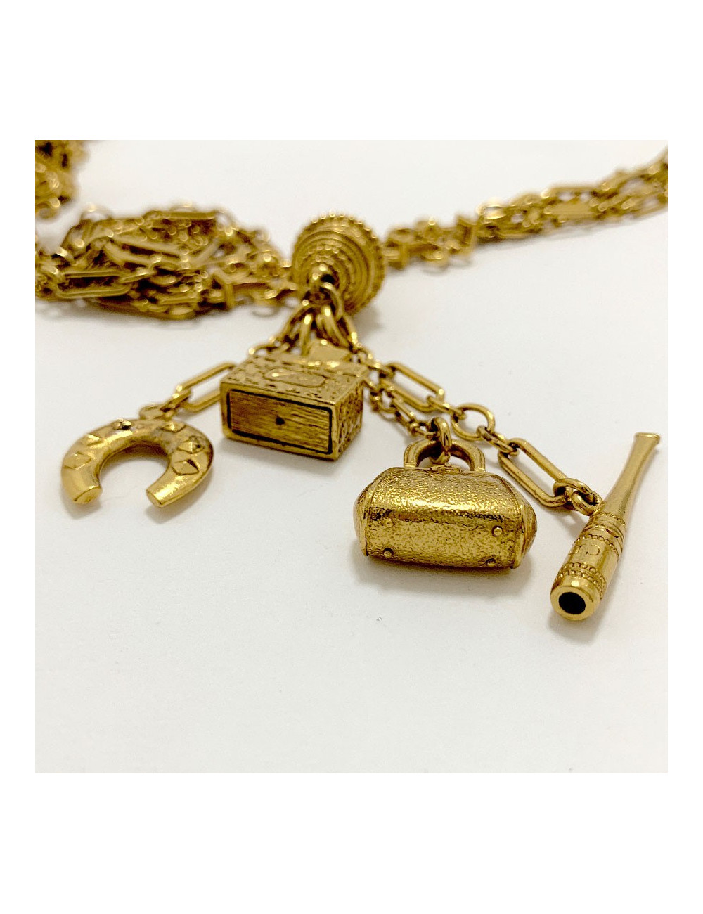 Long sautoir CHRISTIAN DIOR multi chaines et breloques dorées