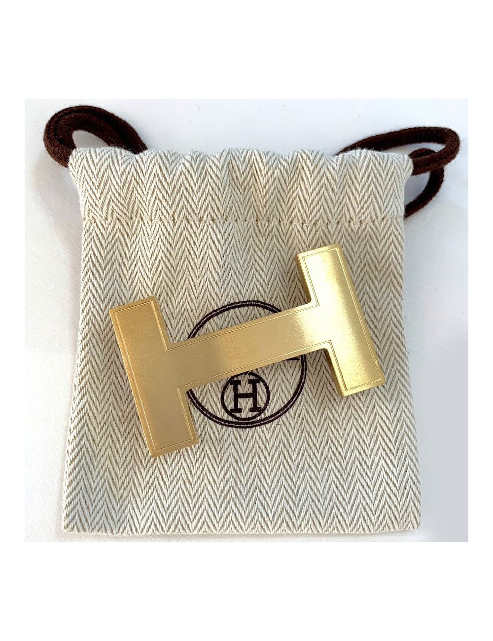 Boucle H HERMES métal doré mat