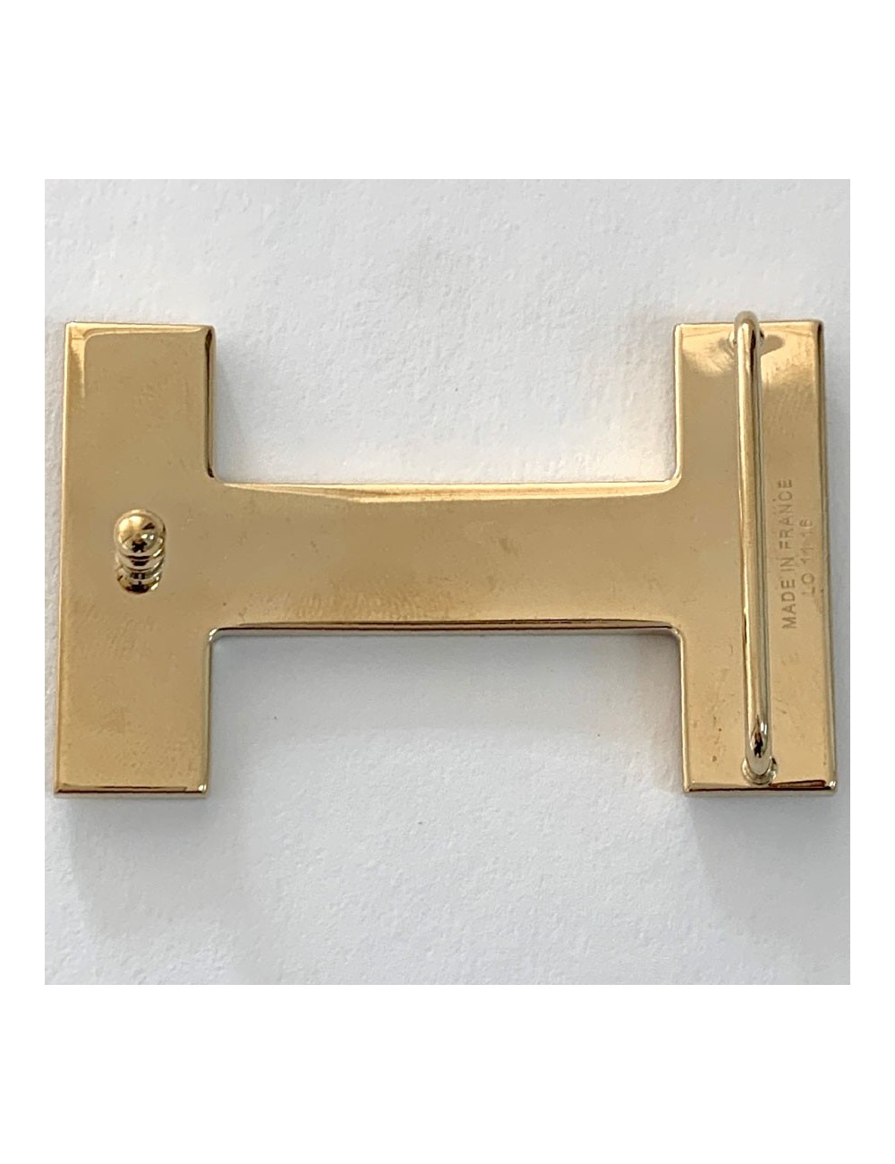 Boucle H HERMES métal doré mat