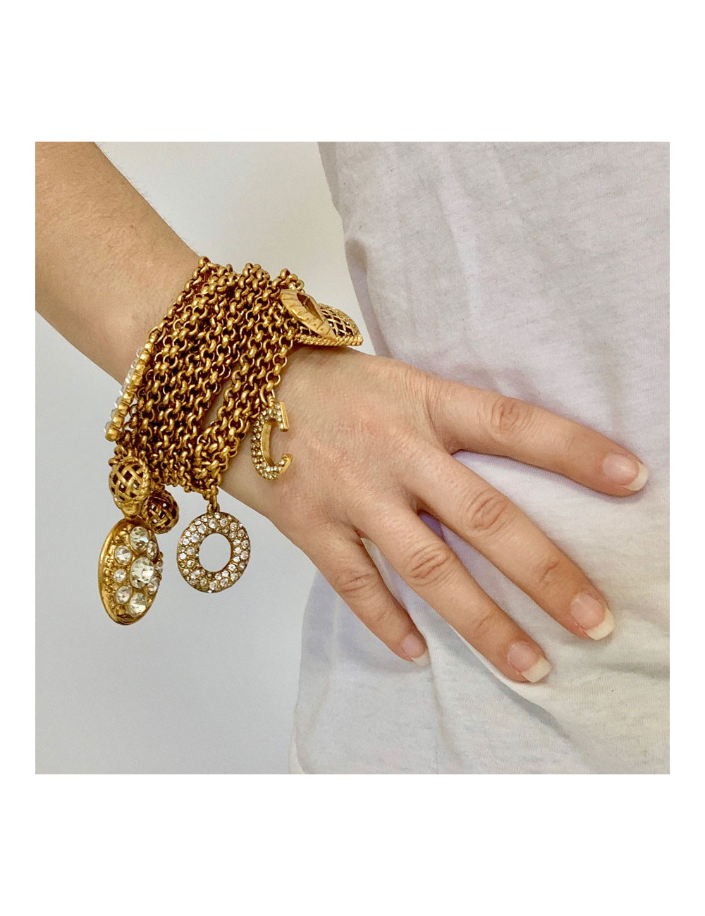 Bracelet charms CHRISTIAN DIOR doré et strass