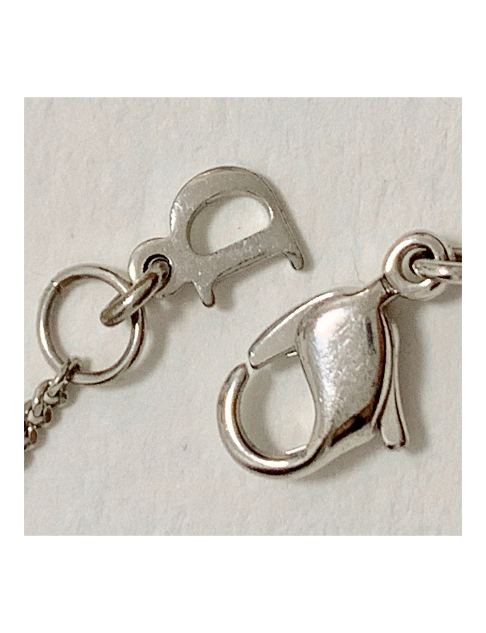 Bracelet DIOR croix strass et métal argenté