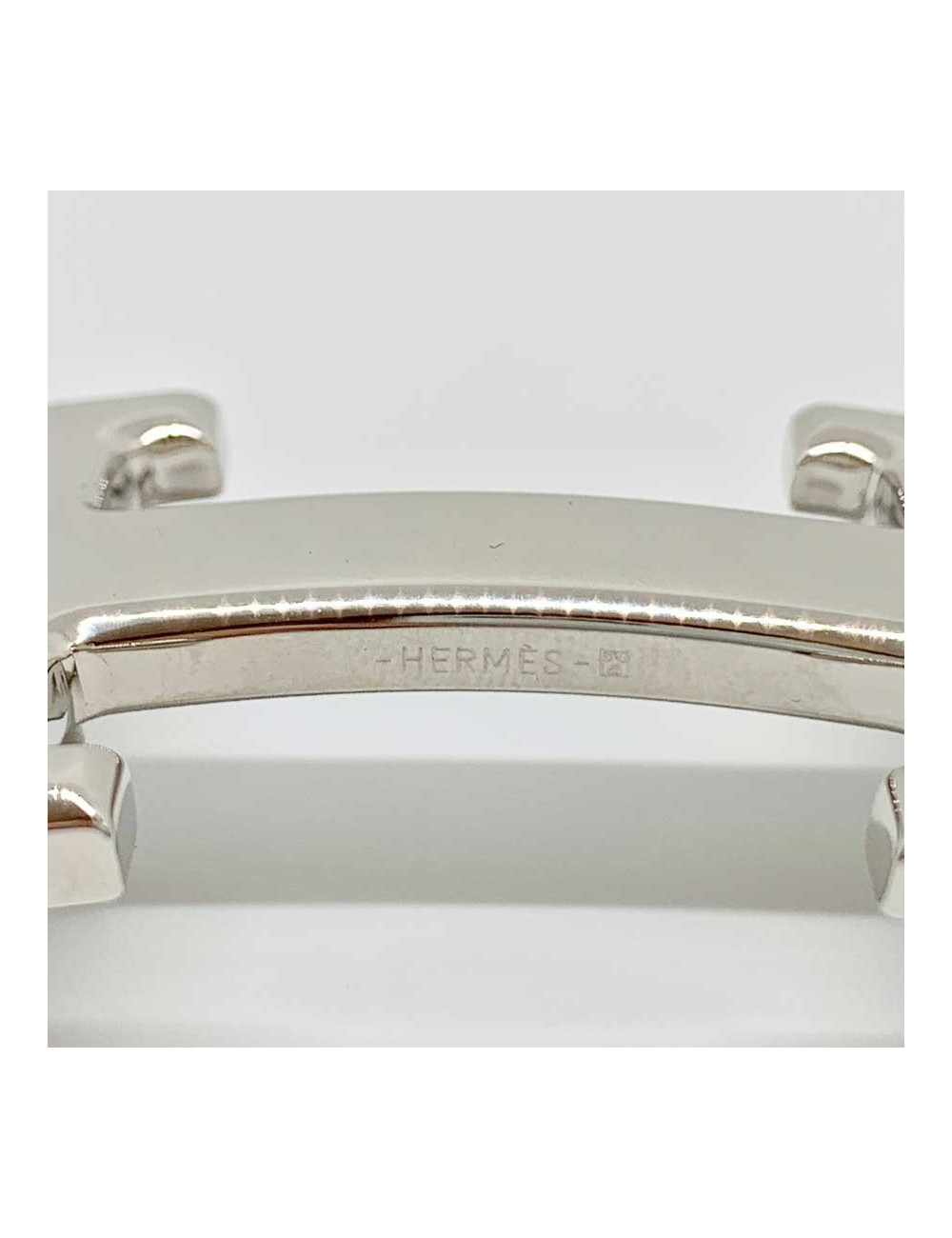Boucle H HERMES argent