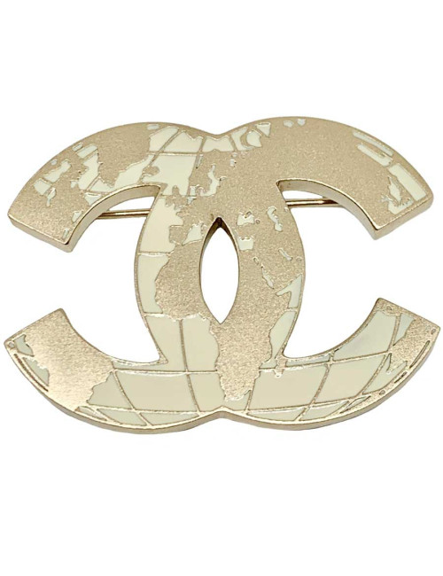 Broche mappemonde CC CHANEL en métal doré