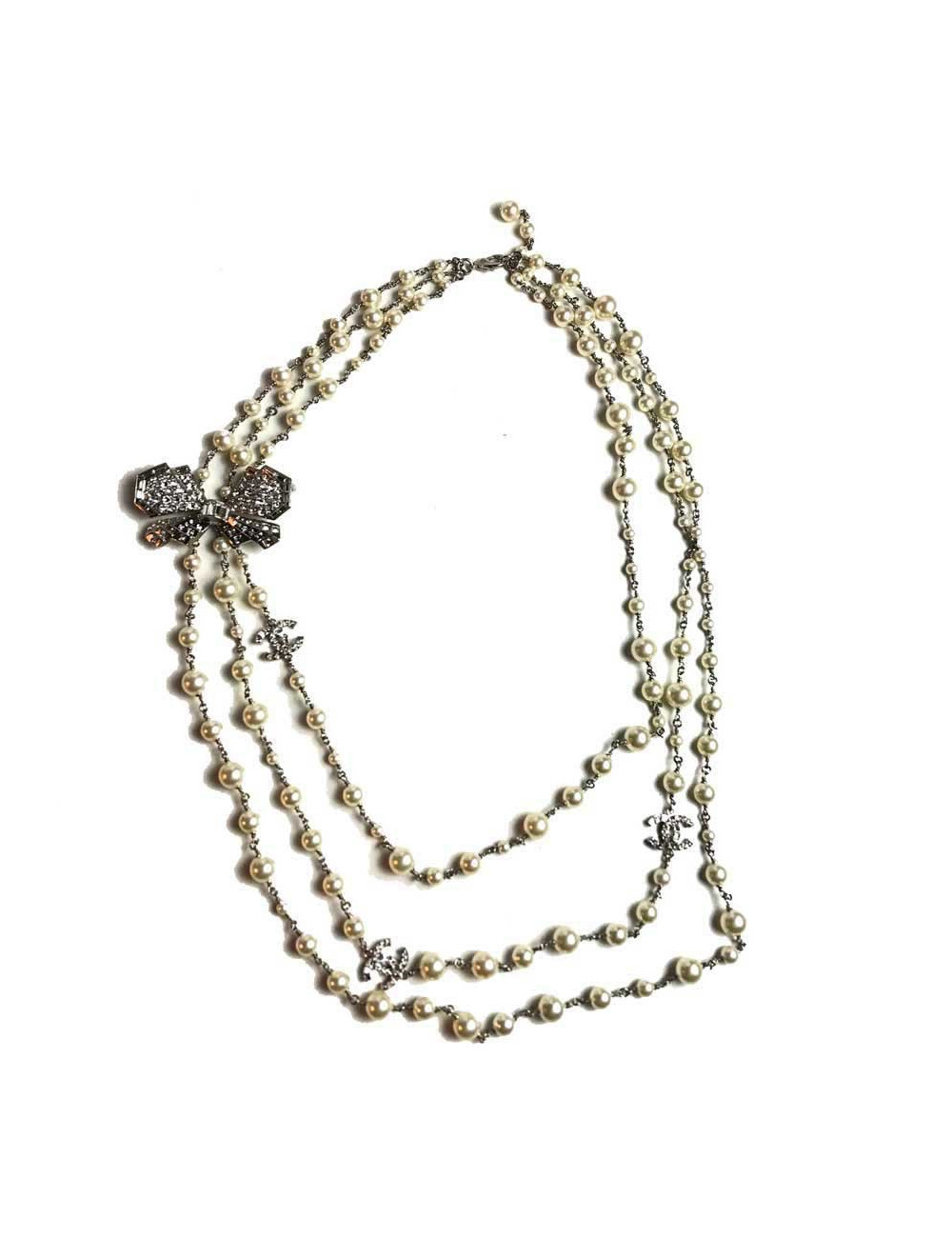 Sautoir Chanel perles blanches et noeud en strass