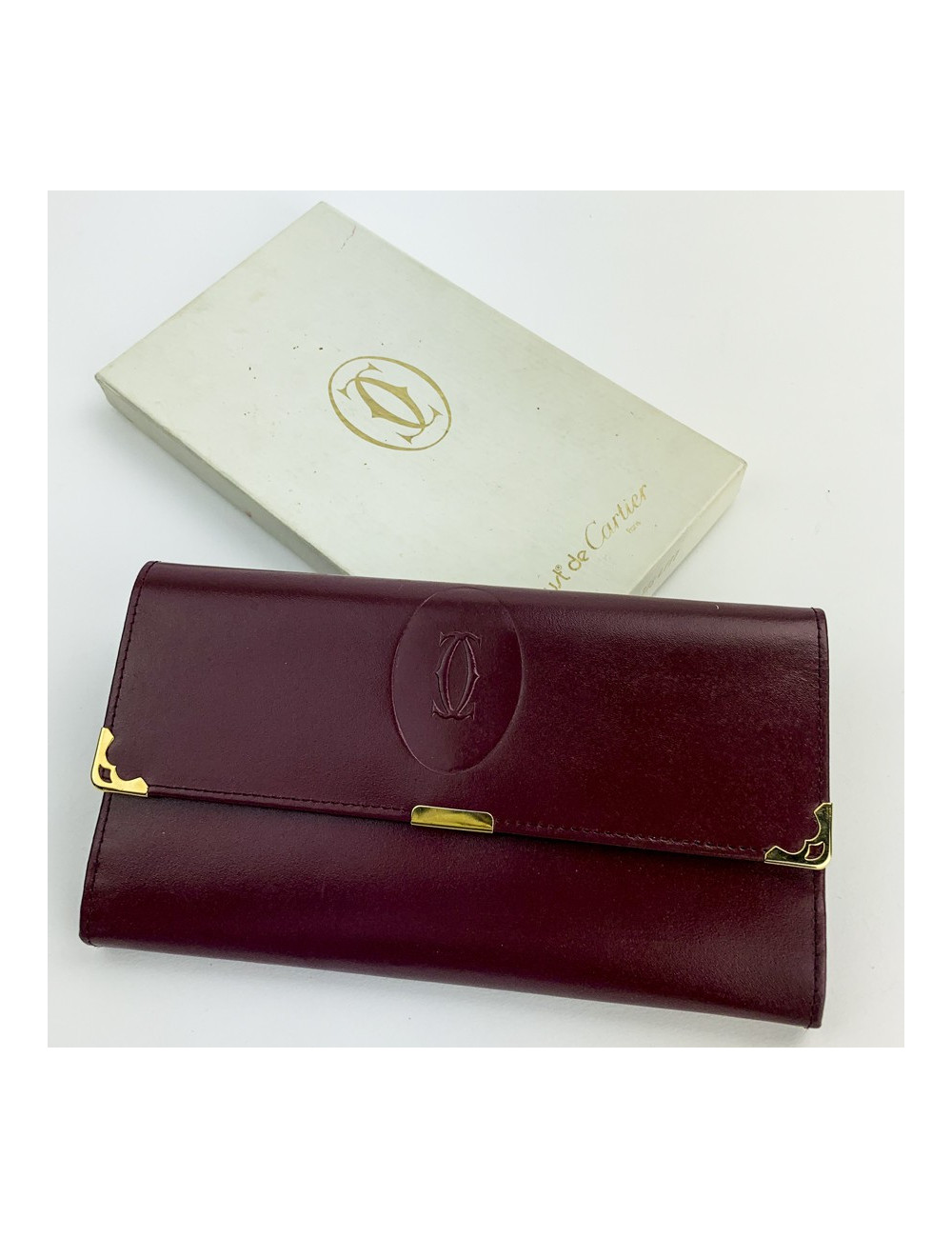 CARTIER wallet in burgundy leather - certified pre-owned luxury