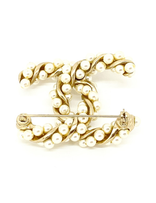 Broche CHANEL torsadée dorée et perles